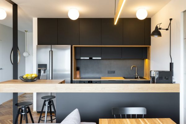 black-wooden-furniture-and-an-industrial-lamp-above-a-coffee-mac-e1604308501463.jpg